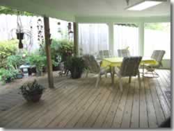 covered deck with chairs